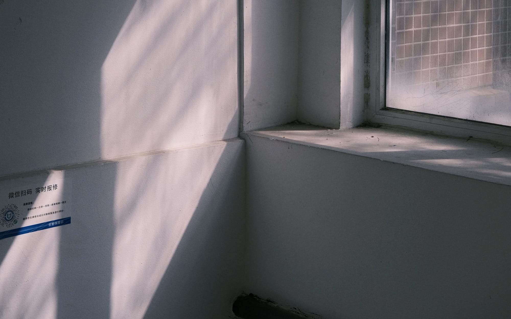 Soft daylight through a tall sash window in a calm room