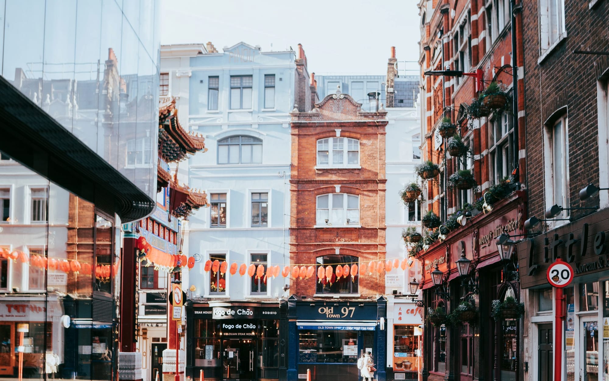 A Soho corner of red-brick buildings, pub frontage and street signs