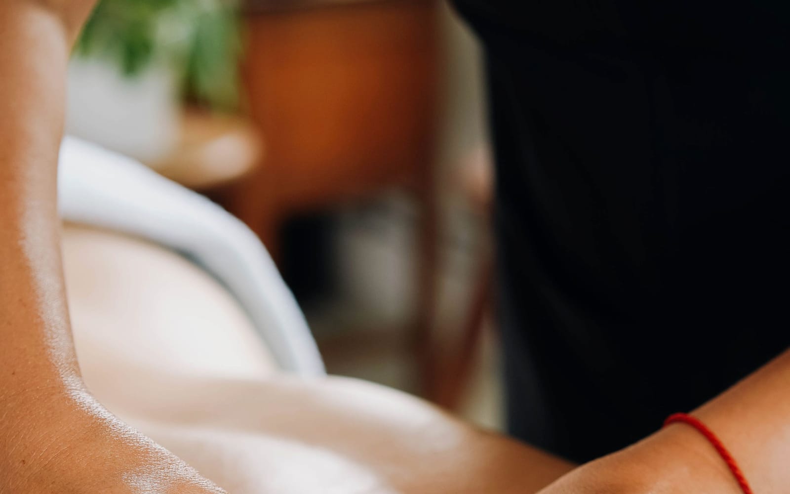 Fingertip work at the base of a client's skull and neck